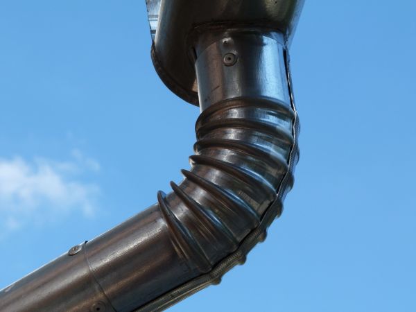 Metal Downspout Installation in Conroe